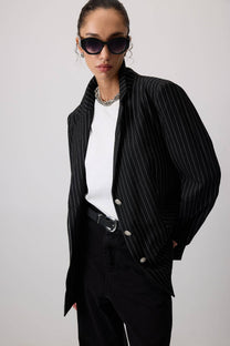 Blazer gessato nero con bottoni metallici