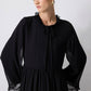 Abito lungo in chiffon nero con volant