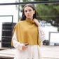 Poncho maglione in maglia a coste con collo alto