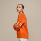 Maglione in maglia con paillettes sulle maniche