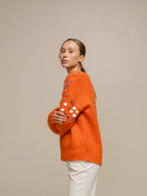 Maglione in maglia con paillettes sulle maniche