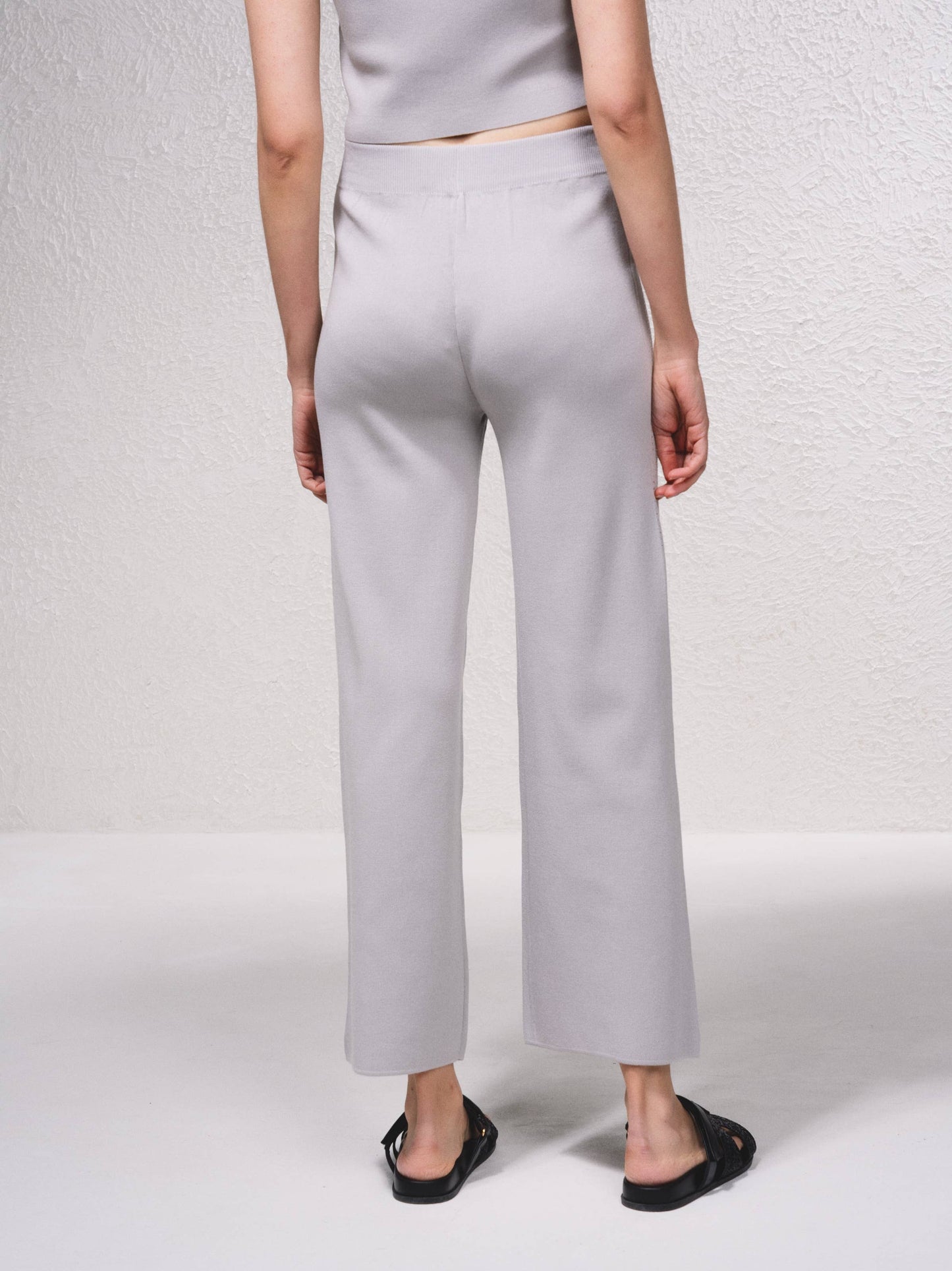 Pantaloni in maglia a gamba ampia con applicazioni glitter