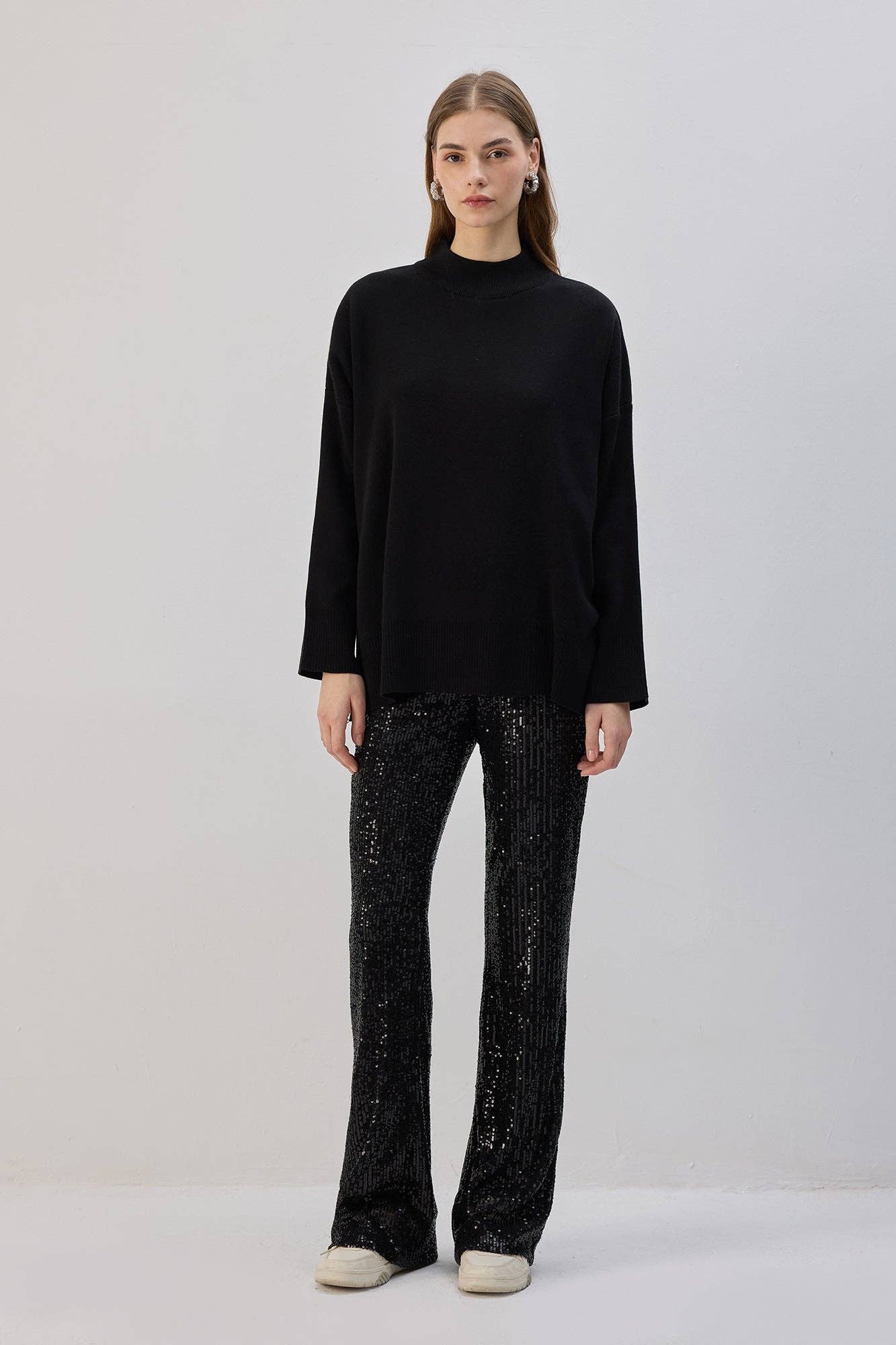 Pantaloni a zampa con paillettes