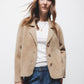 Cappotto corto in pelliccia sintetica beige