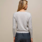 Cardigan in maglia con scollo a V smerlato
