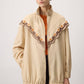 Giacca impermeabile ricamata beige