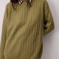 Maglione a coste verde con girocollo
