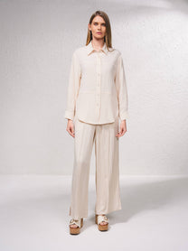 Camicetta oversize con bottoni frontali e colletto classico