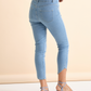 Pantaloni skinny in denim azzurro con borchiette