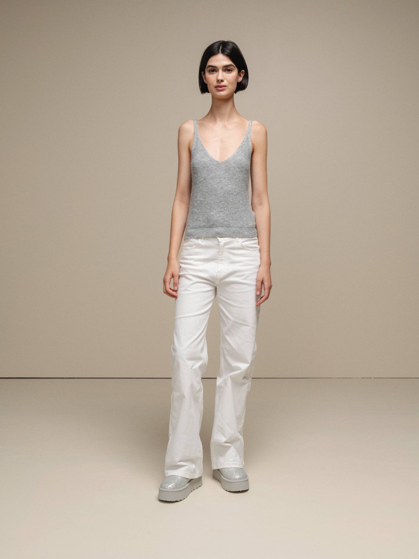 Canotta in maglia lurex versatile con scollo a V