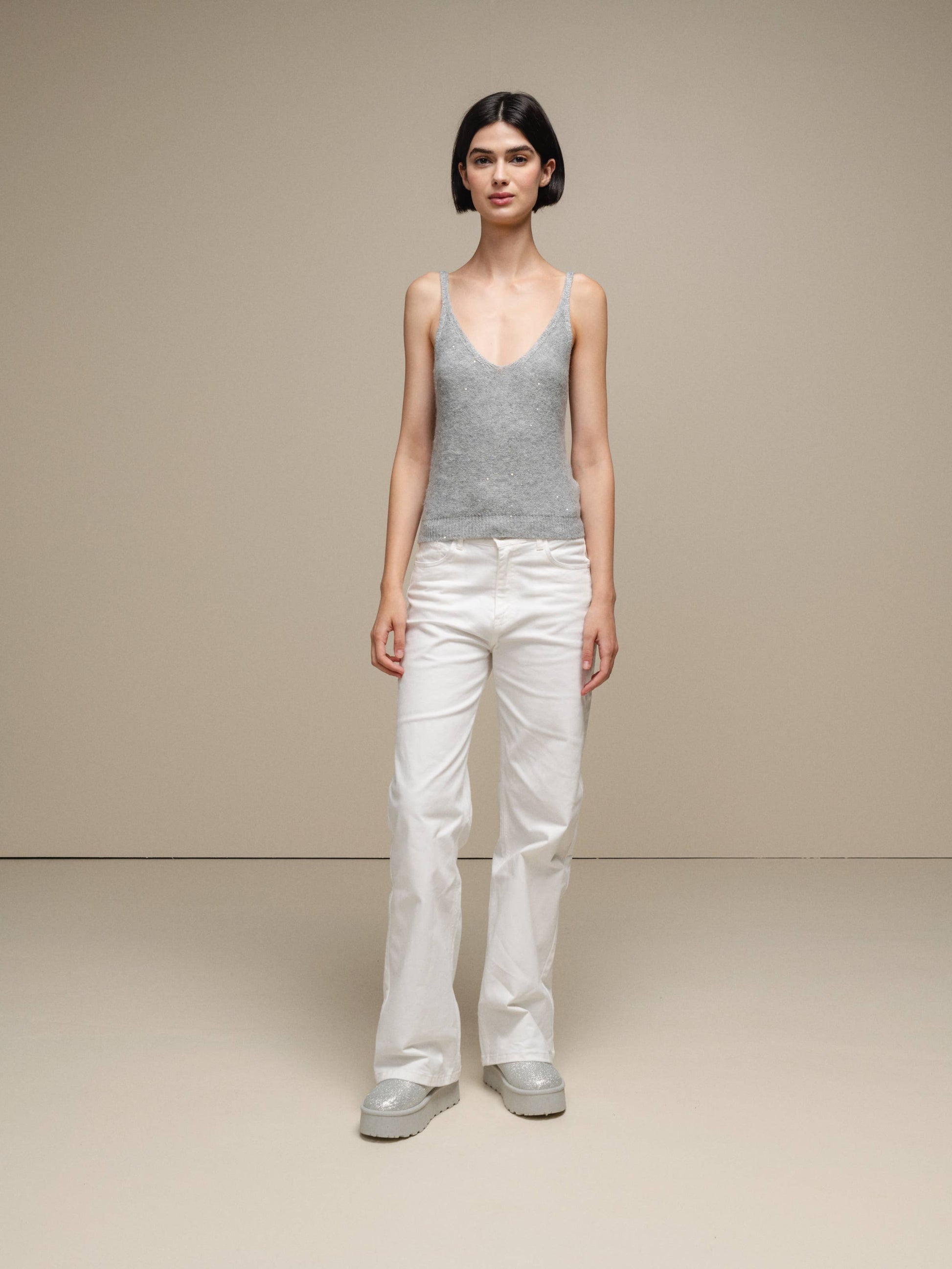 Canotta in maglia lurex versatile con scollo a V