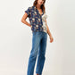 Blusa stampata bicolor con scollo a V