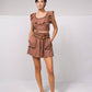 Top crop aderente con volant