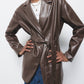 Cappotto in ecopelle con cintura