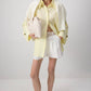 Camicia in popeline giallo burro con polsini oversize