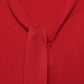 Maglione in maglia rasata con scollo a V e fiocco