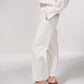 Pantaloni dritti con bottoni decorativi e vita elasticizzata