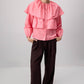 Blusa corta rosa con balze e maniche a sbuffo in misto cotone