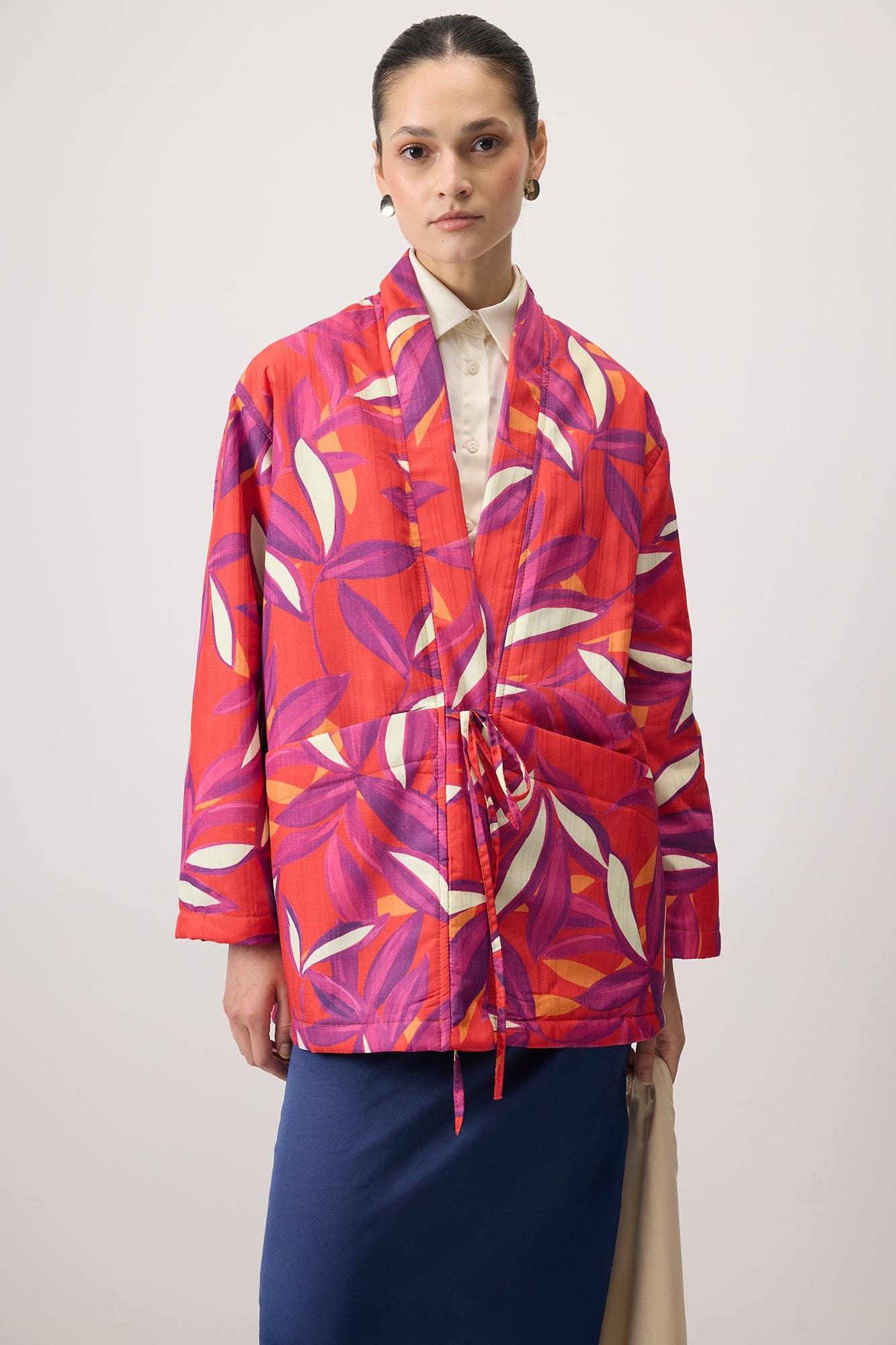 Cappotto fantasia con nodo frontale
