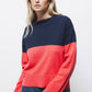 Maglione bicolore in maglia con finiture a coste