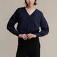 Maglione corto tweed con doppio scollo a V