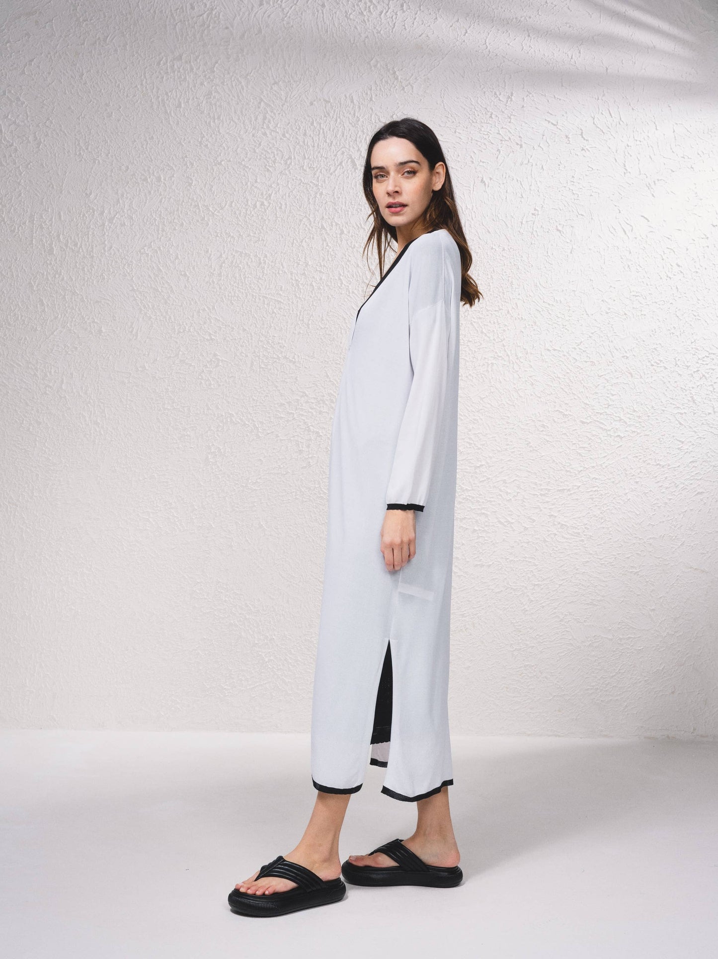 Cappotto lungo in maglia fine con scollo a V