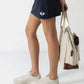 Gonna pantaloncino sportiva con shorts interni e tasca laterale