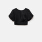 Top crop con maniche a palloncino e fiocco sul retro